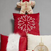 Cojín rojo con copo de nieve
